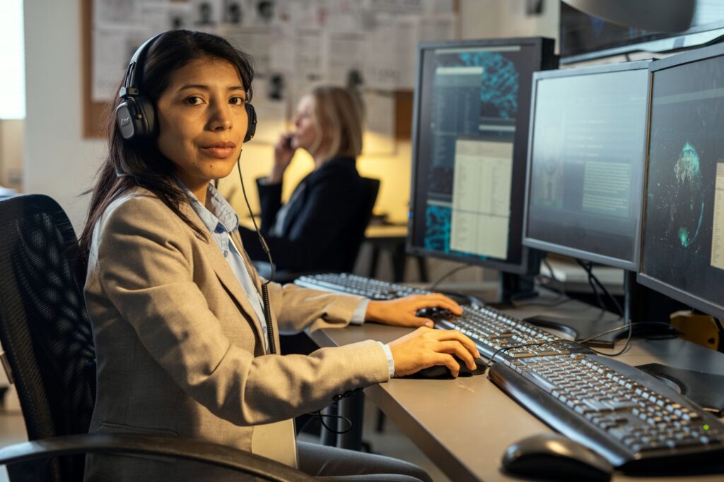 CompTIA Network+ learner sat at desktop computer