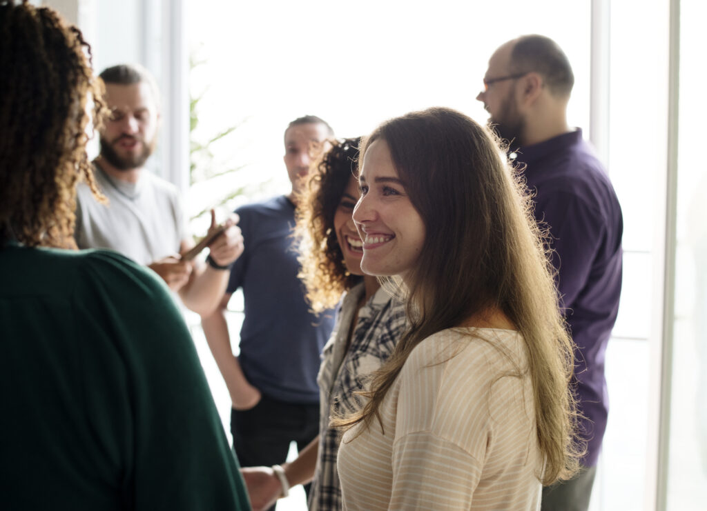 Group of people mixed nationality talking and smiling